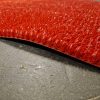 Lábtörlő tekercs, piros, műanyag tüskés, kaparó, sárleszedő, 91cm széles tekercs "AstroTurf"